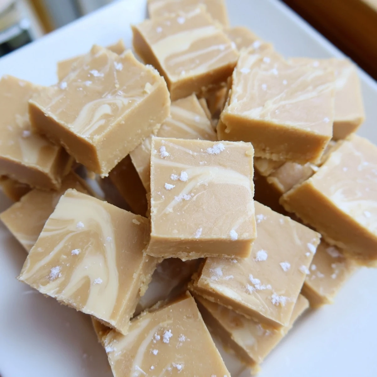 Creamy, melt-in-your-mouth Irish Cream Fudge squares with a smooth white chocolate texture, perfect for holiday gifting.