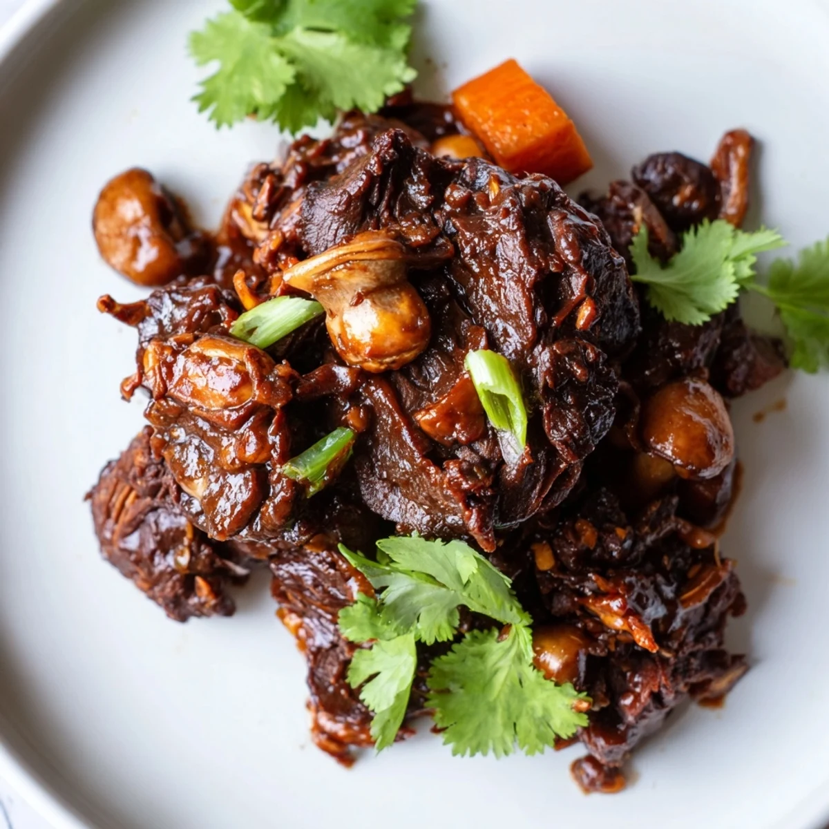 Close-up of Asian Style Slow Cooked Beef Cheeks with Mushrooms showing fork-tender meat, earthy mushrooms, and aromatic spices.