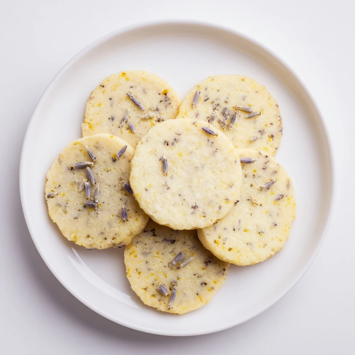 Close-up of soft lemon lavender cookies showing golden edges and bright lemon zest