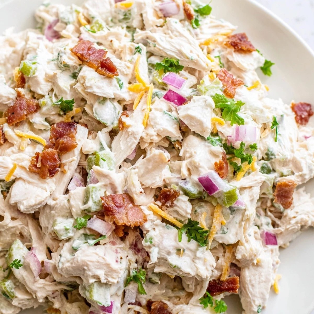 Spicy keto chicken salad with diced jalapenos, crumbled bacon, and tangy cheese dressing