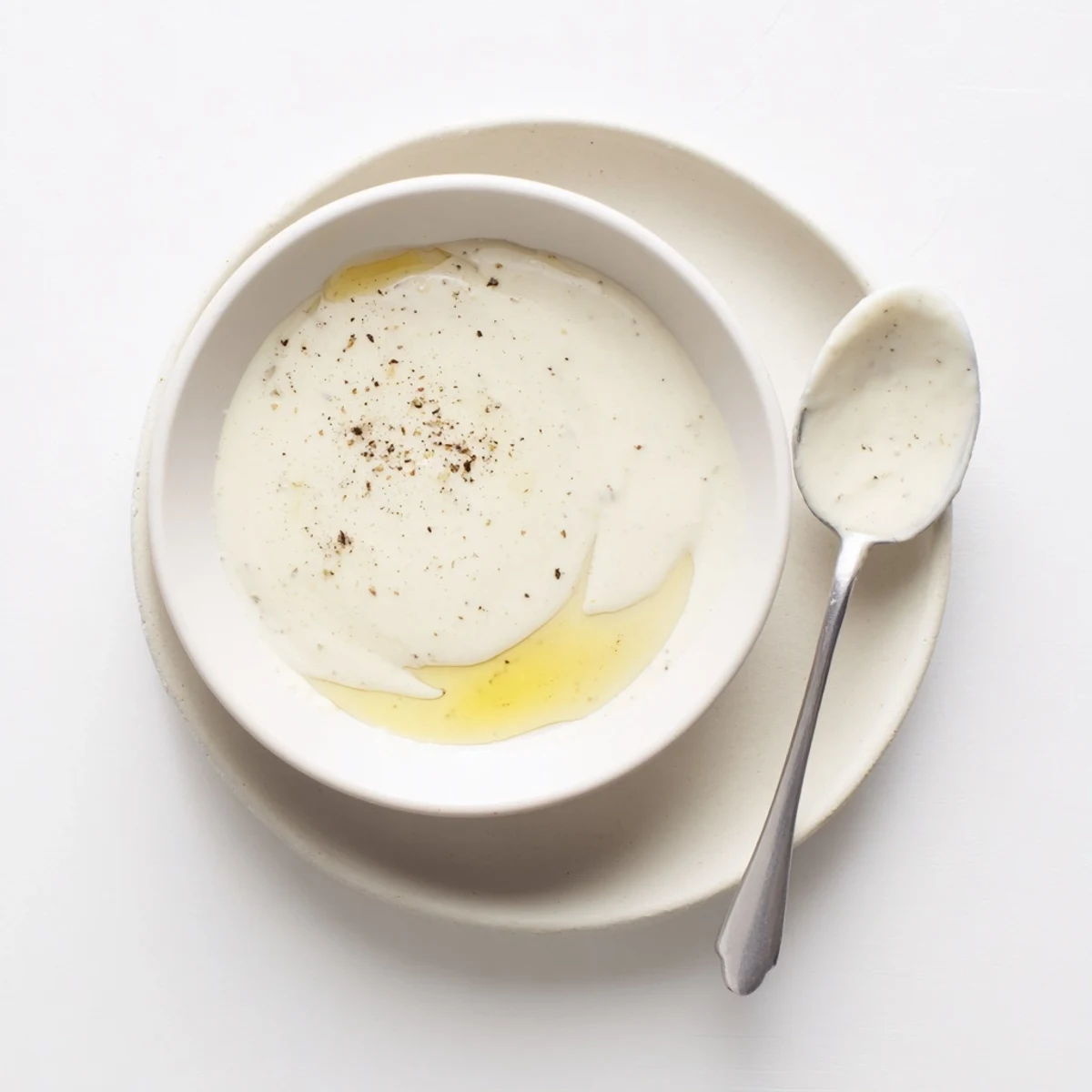 Creamy white chicken shawarma garlic sauce drizzled over spiced grilled meat and fresh vegetables