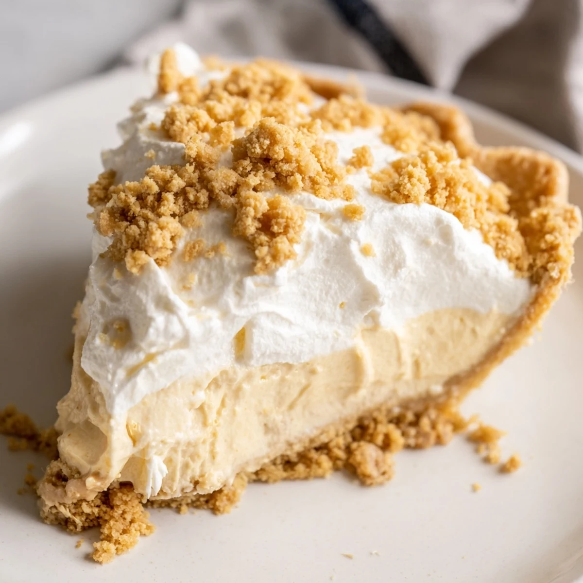 Old fashioned Amish peanut butter dream pie with velvety custard filling in flaky golden crust