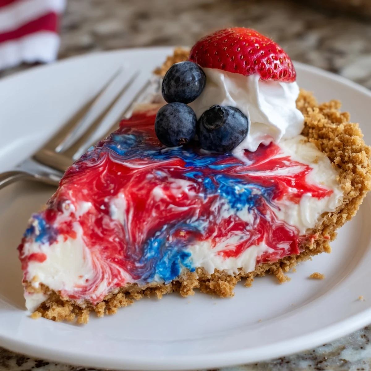 Chilled Patriotic Red White And Blue Swirl Pie topped with fresh berries