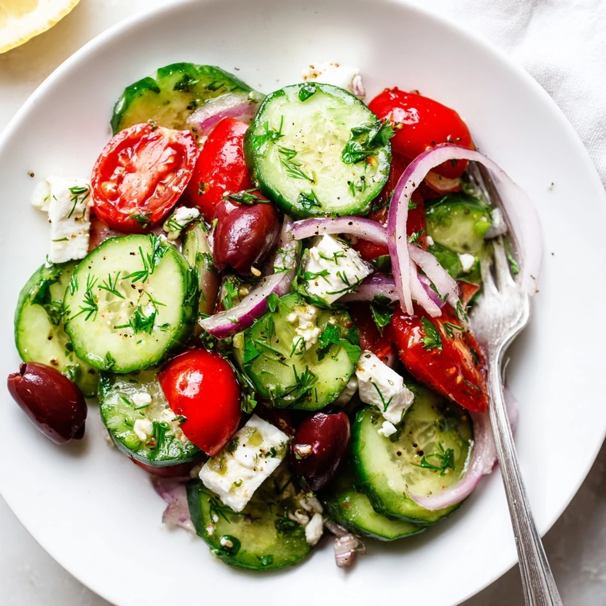 Bright Mediterranean Cucumber Salad Recipe served chilled with olives, lemony dressing