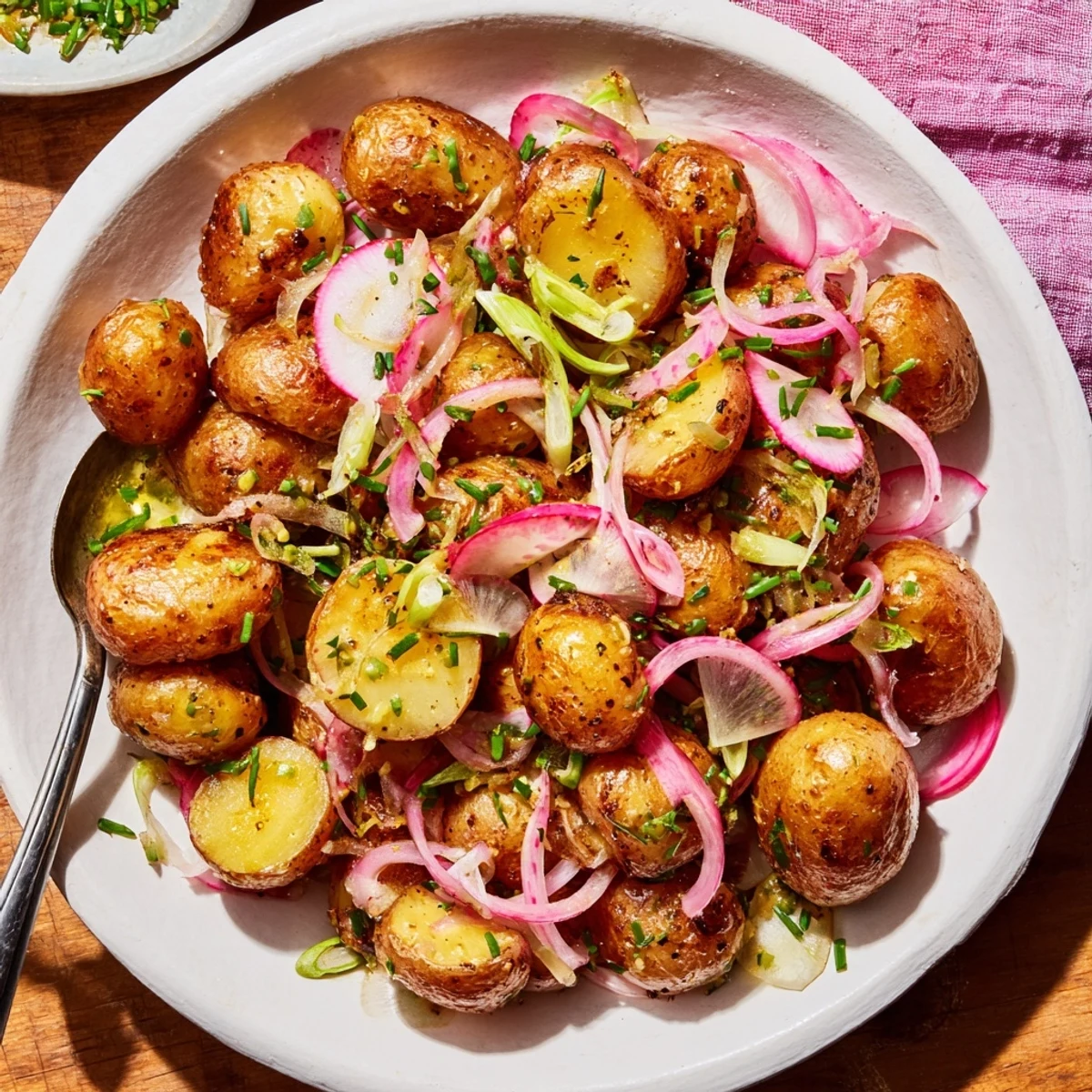 Golden roasted potato salad tossed with tangy mustard dressing and fresh herbs